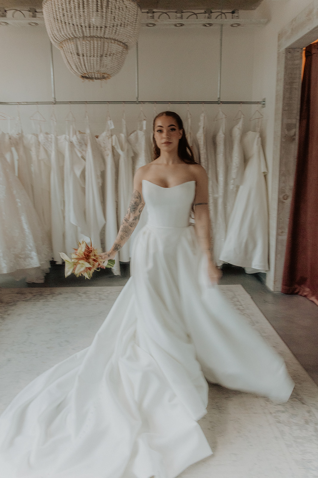 Bride in the fitting room at Cande Bridal Boutique