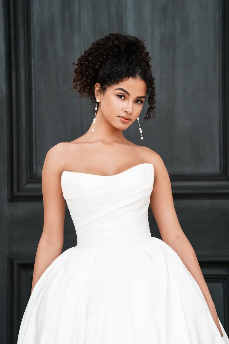 Allure Bridals style A1359 gown hanging on the sales floor at an independent bridal boutique