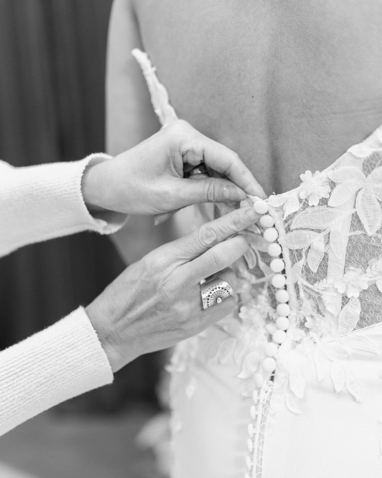 Close detail of covered buttons down the back of a gown